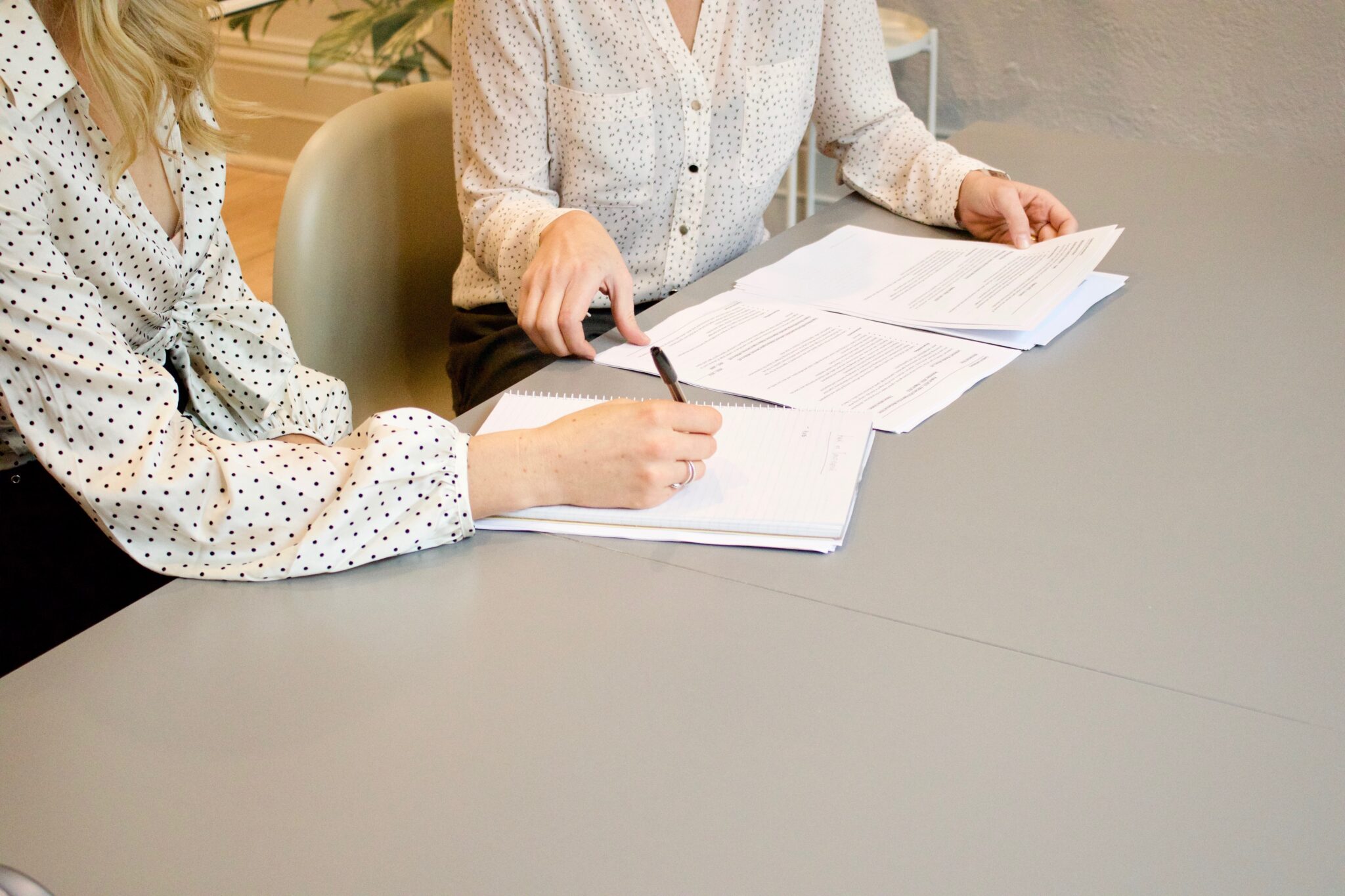 Colleagues reviewing financial documents at a table