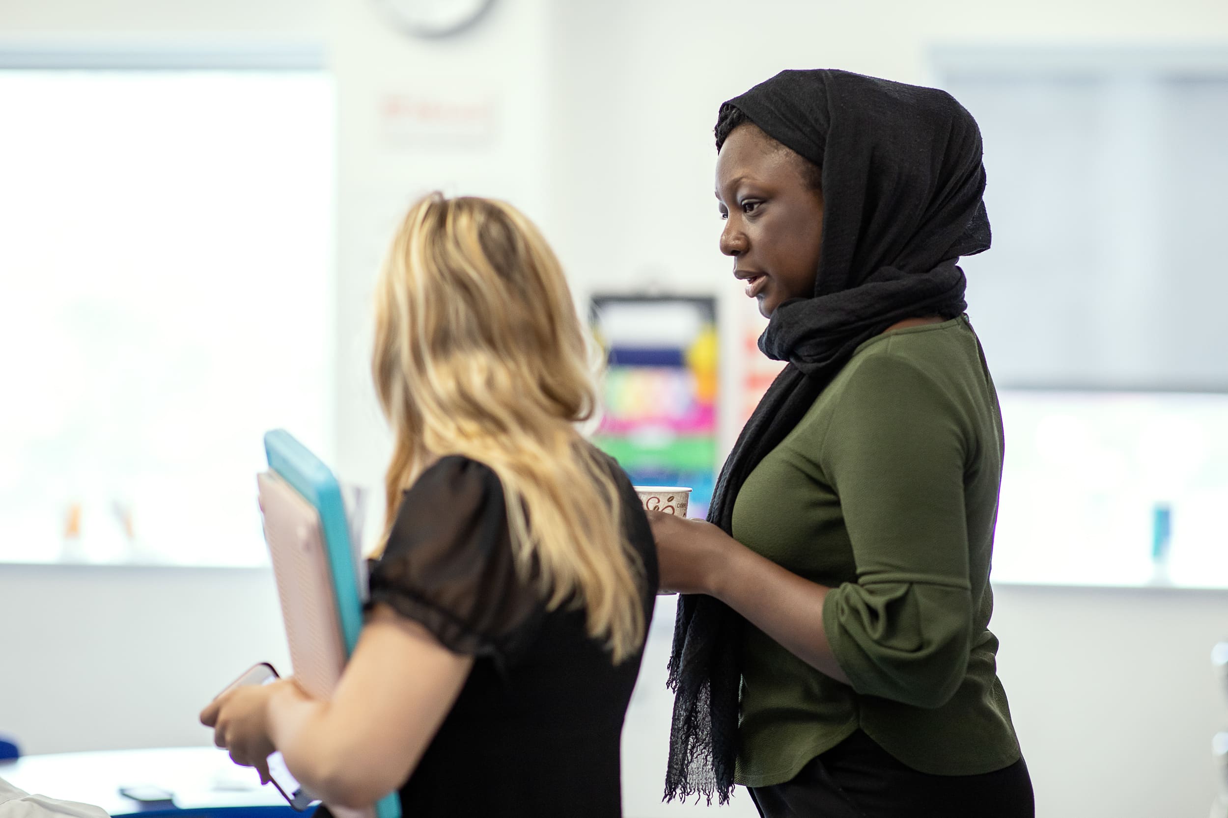 Two colleagues discussing a document