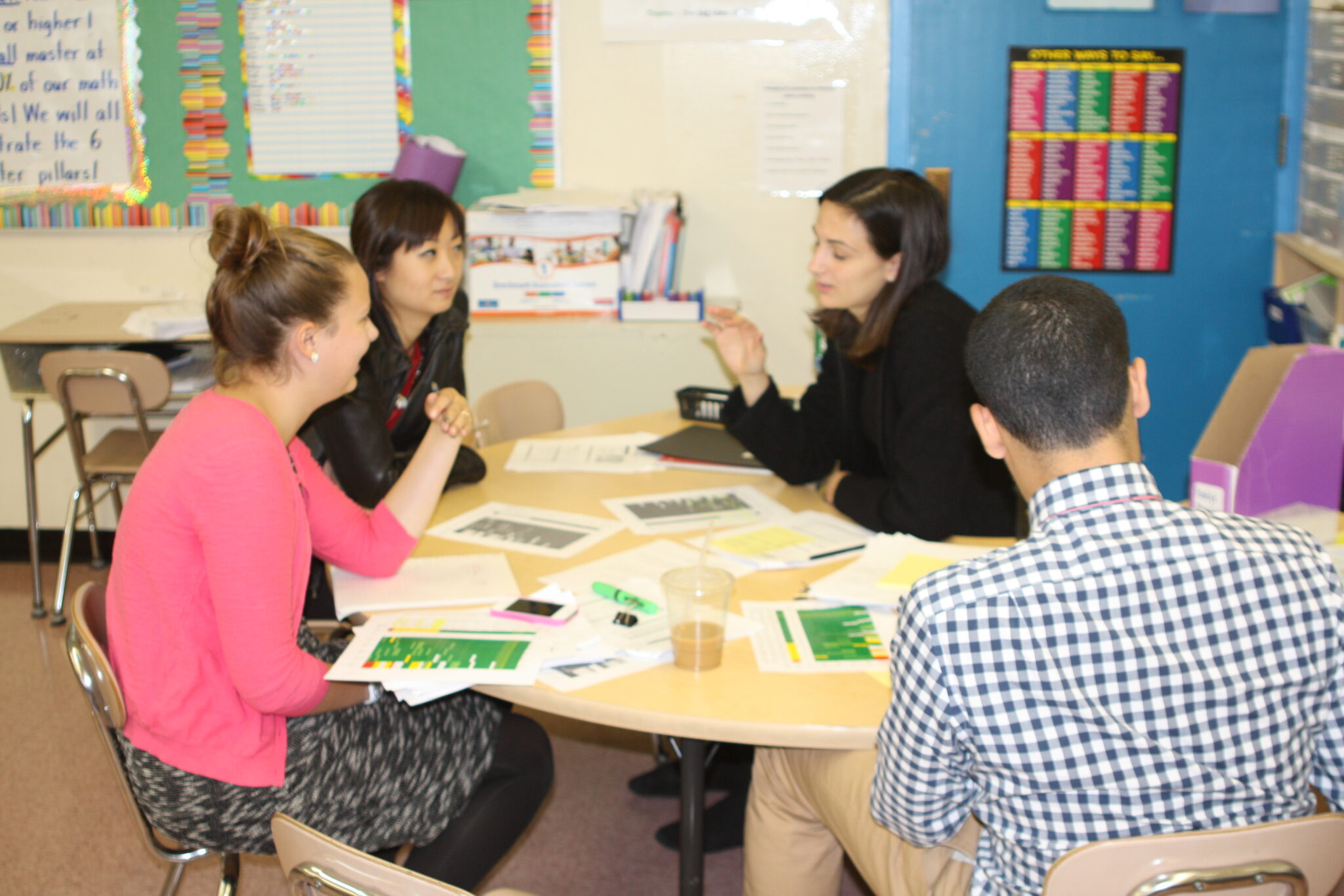 Educators meeting to discuss student data and coaching