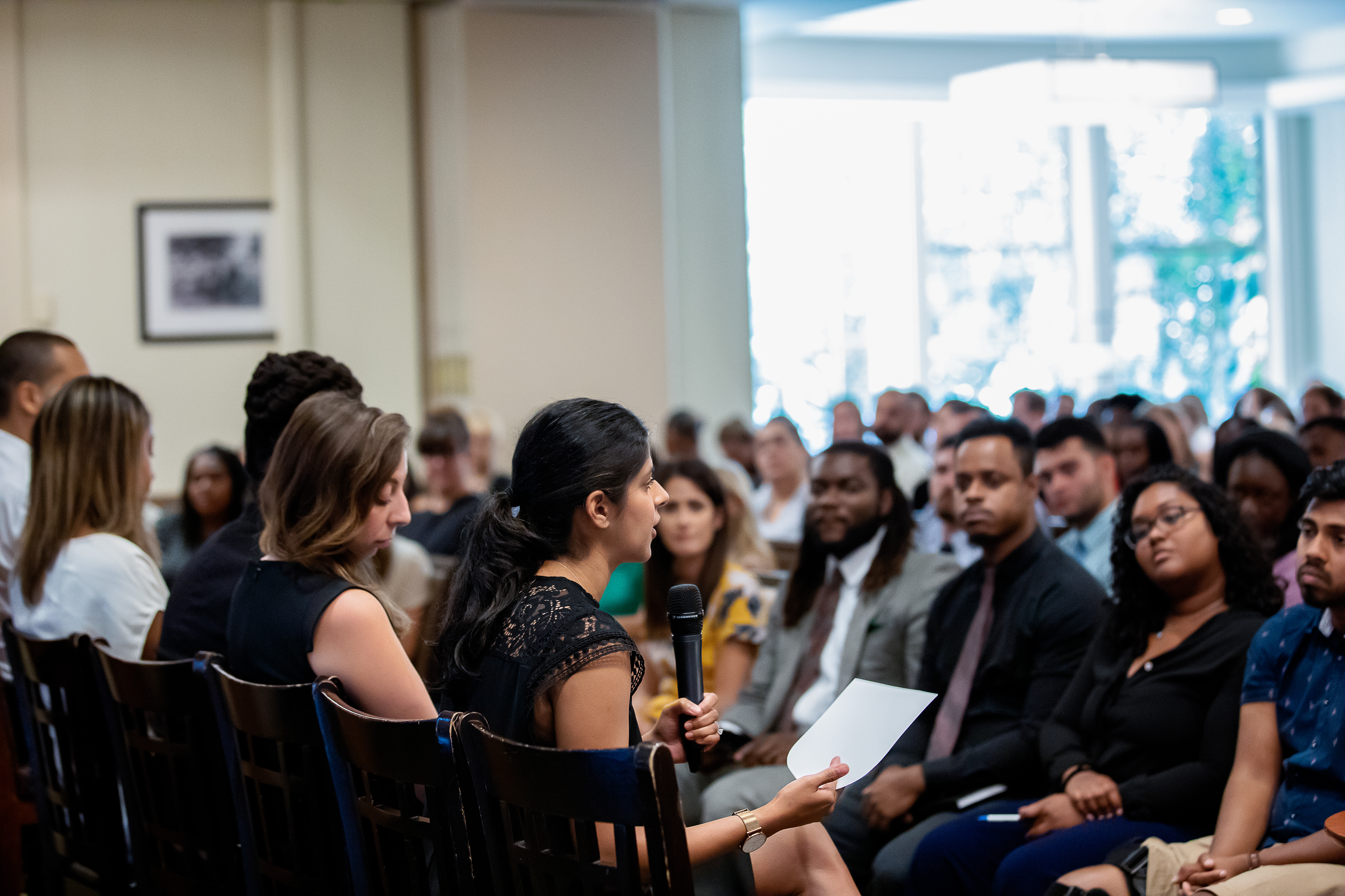 Staff member speaking during a Classical Charter Schools meeting