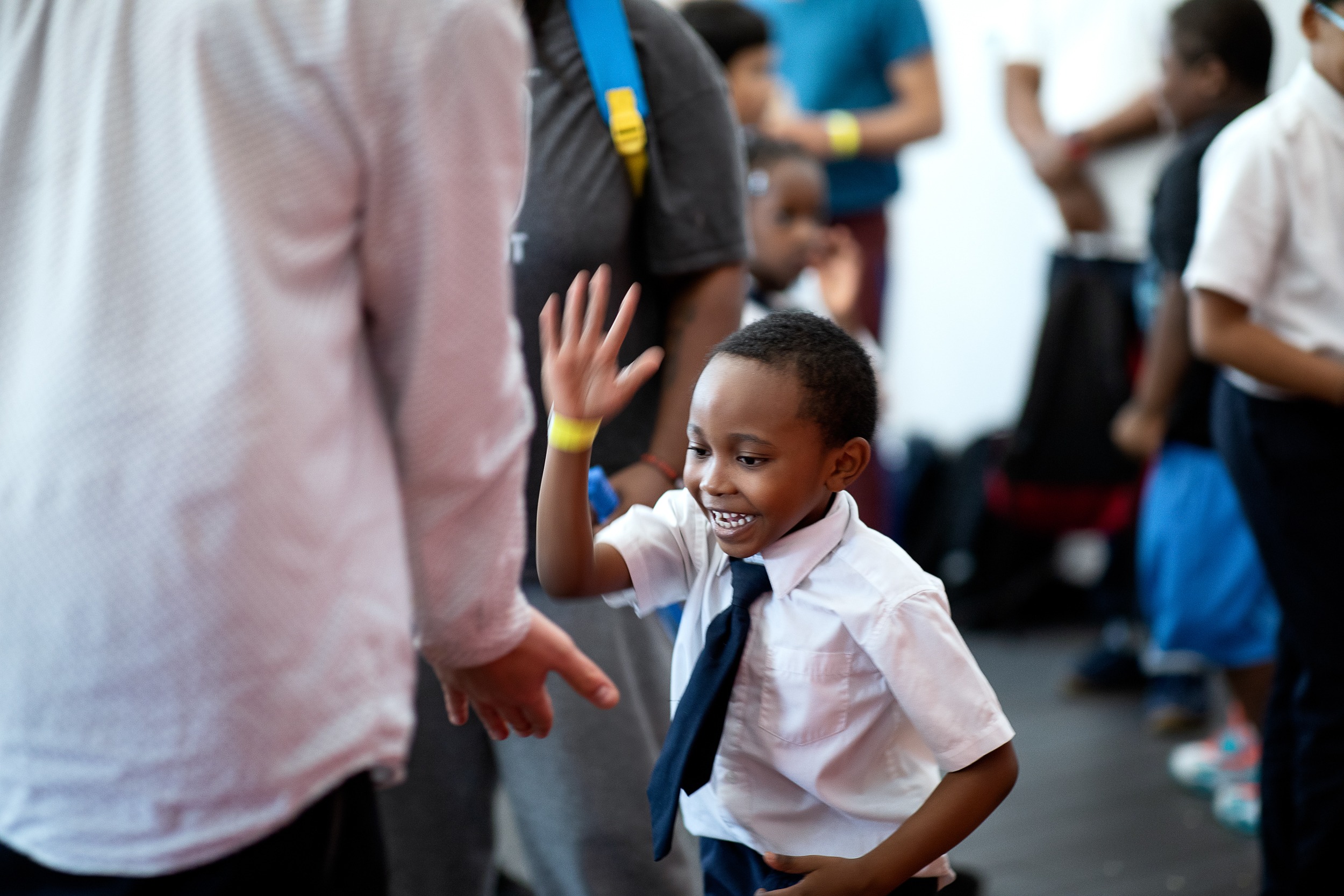 Young scholar giving a high five at school