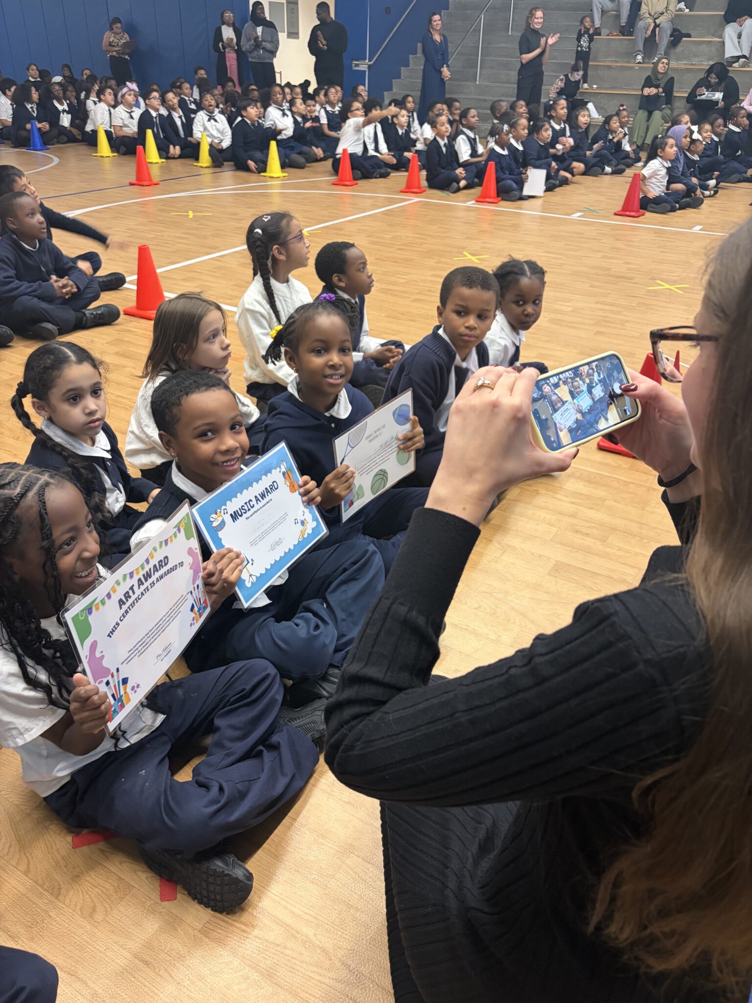 Scholars receiving awards at a school community gathering
