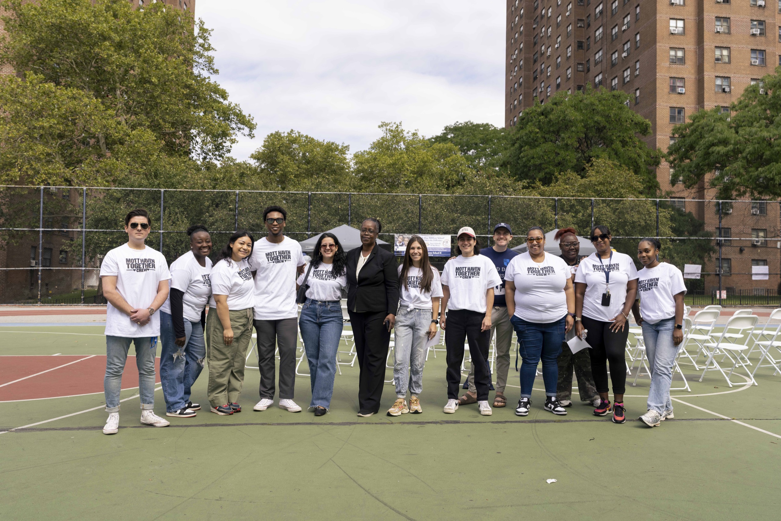 The Mott Haven Together crew gathered on the School II court
