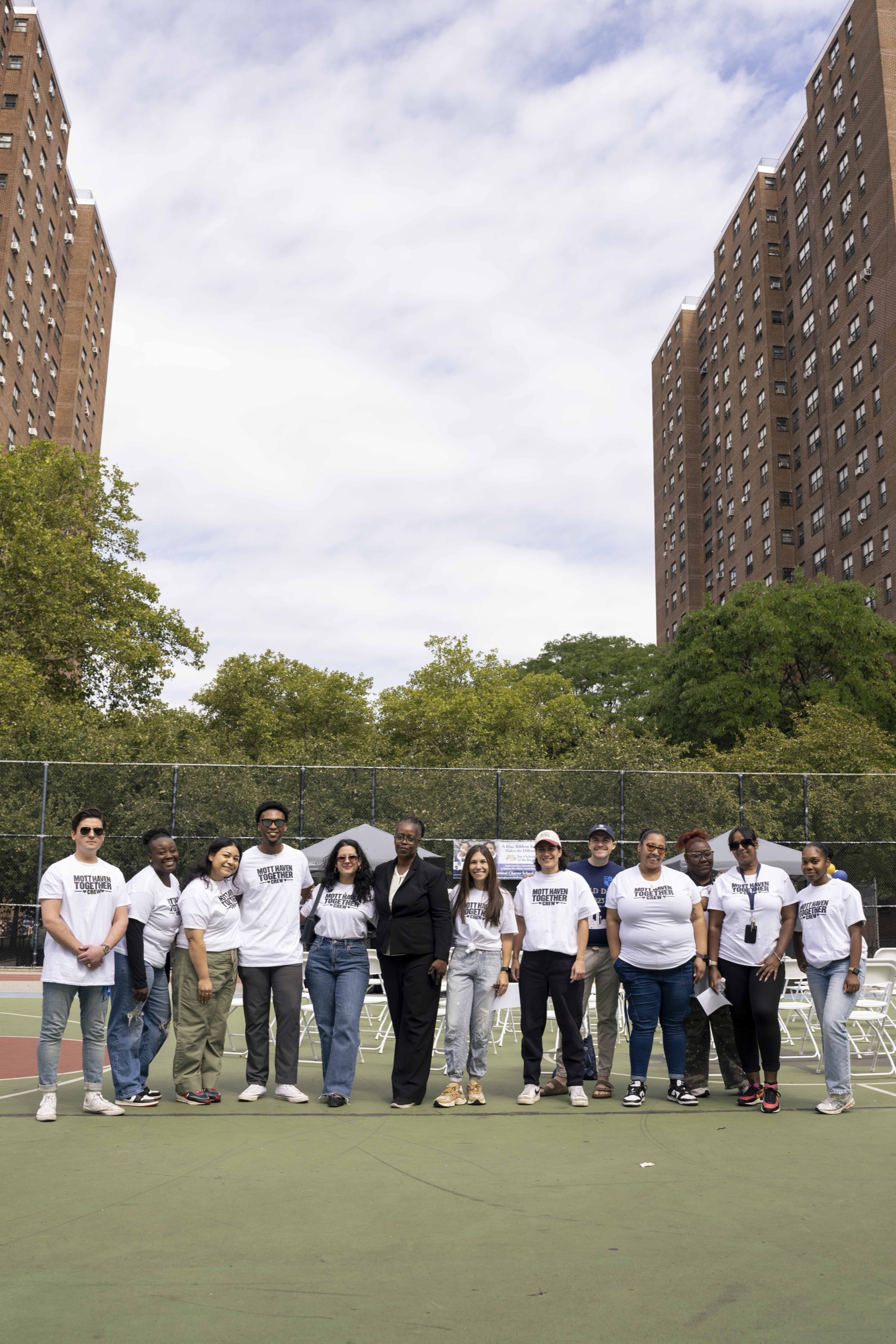The Mott Haven Together crew gathered on the court
