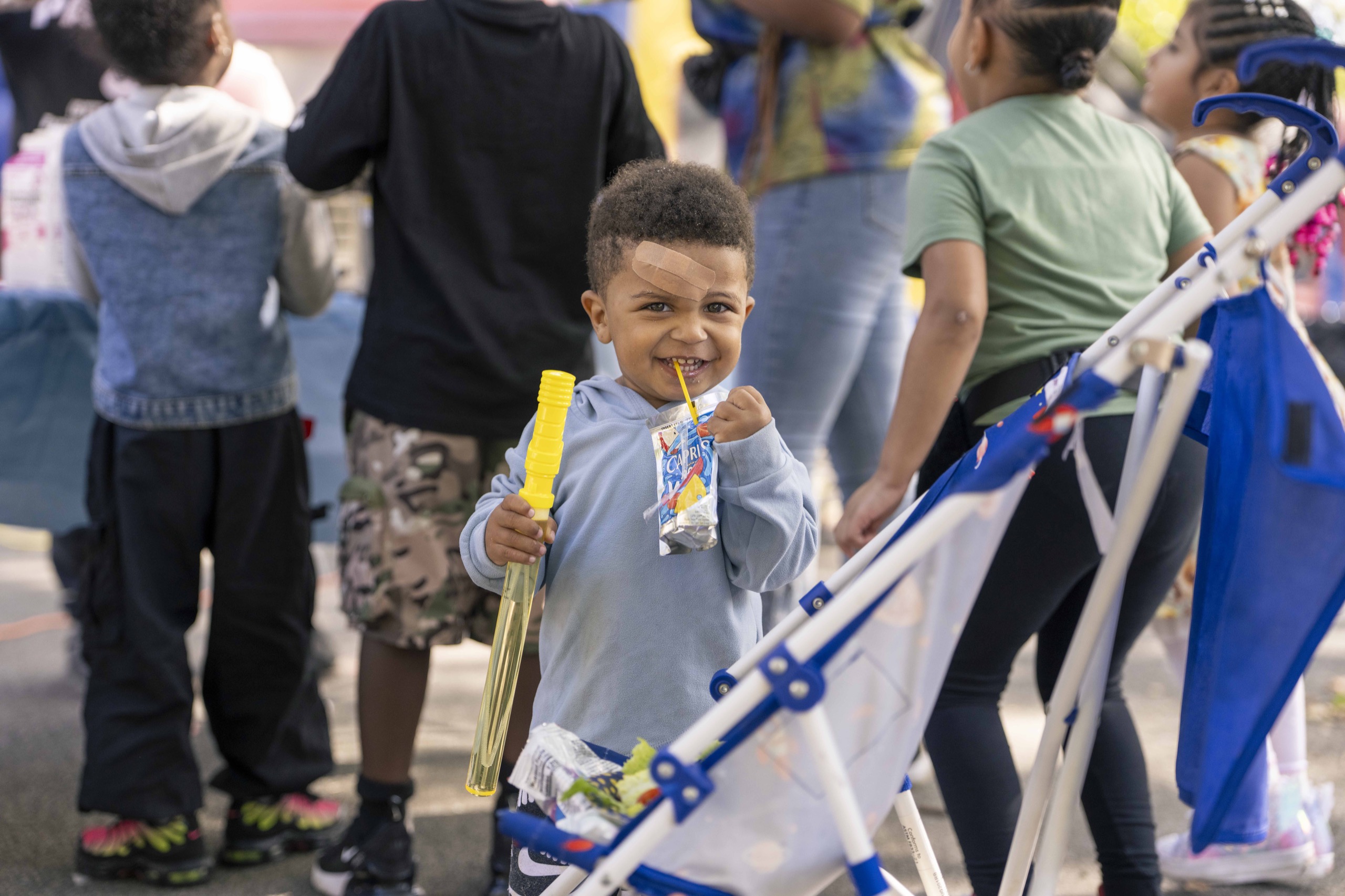 A young guest enjoys the Mott Haven Together celebration